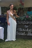 I purchased this dress for my Bridal Shower. I am in love with it! It feels like a heavy linen material. It's very comfortable & I didn't feel like I was going to fall out of it. I wore heels but it still needed to be hemmed an inch or two. I wore it outside & since it was so long, it was inevitable that there would be stains at the bottom. They easily came out with stain remover & "delicate" wash (hang to dry). I would buy this dress in every color, it's beautiful and I received lots of compliments. (All of my bridesmaids are wearing Lulus dresses, btw). I'm 5'2", 127# I bought and xs & it fits TTS. - ERIKA A.