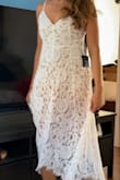 It's a little stiff but comfy dress. Not a ton of movement. Nevertheless it's beautiful. I used it in an engagement shoot. Very happy with it. I can see myself wearing again for bridal party or just a warm sunny day. Beautiful dress. - Maribel M.