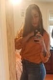 I love this shirt. I bought it in booth the orange and white. Ties in front really well or buttons, you can't do wrong! - Emma V.