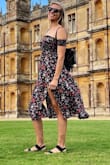 I bought this for a recent London vacation and it was the perfect versatile dress. It's casual enough to just wear around town but dressy enough to wear to a nice dinner. I'm usually a medium in Lulus but can sometimes wear a small so I ordered a small because that's all that was in stock. The small was definitely wearable since it's a stretchy material but I probably could have been a little more comfortable in the medium (the arms were a little tight and I have decently skinny arms). I love the way this dress flows with the slits when I'm walking. I've worn this multiple times since I've gotten it so definitely a keeper! - Laura M.