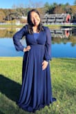 Bought this for a wedding. Beautiful quality material, and looks expensive. The only thing is that I lean on the more conservative side, and this V neck definitely runs on the more showy side, so I had it tailored, but I also knew this choosing the dress. The length is also on the longer side for my height, so I have to get that fixed. Beautiful dress! If you're also 5'4" I'd also plan for some tailoring. - Lorrany C.