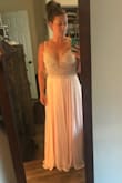 So, my sister's bestie threw herself a 40th Birthday Party of wedding proportions: A formal masquerade ball in Toronto. Yes, it was amazing, as was this dress! I felt like a freakin' Disney princess (a champagne-drinking, sailor's mouth kind of princess). The fit was great, although, if it had come in a 9, it would have been perfect. I have a broader back and because the zipper hit (literally like a centimeter too high) I couldn't get the 8 to fully zip. The 10 fit well and looked great, but I did have to maintain great posture to keep the straps from wanting to slide. In other words, my chest filled out the 8 much better than the 10 but the 10 fit in the waist better. I ended up getting those silicone bra pasties to help with the bodice sizing. It worked out great. Perfect length as long as you like to wear higher heels. I was impressed by the bead work of the bodice, very well constructed albeit a little heavy. I did have to cut the ribbons out that you use to hang the dress up because you could see them through the mesh underarms and I'm a little worried about the beaded straps holding up on a hanger in storage. But small complaints about an overall very satisfying purchase. - Ashley P.