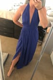 I love this dress. The color is stunning and the fit is great too. I was worried about how revealing it would be since I am small chested there isn't really much to hold the dress in place. I was able to wrap it tight enough to make more of a deep V rather than that 1-inch space that other reviews are talking about. The length is also perfect for me, I am very short so usually, things are too long on me but once I put heels on this dress will be perfect.
I got this dress for a Texas winter wedding coming up and I can't wait to wear it. - Gina G.