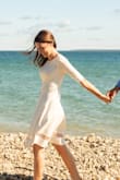 I just about returned this dress because it seemed loose and homely until I took in the sleeves and bust of the dress to make it a bit more form-fitting. Now I love the dress and wore it for engagement photos. - Carolyn M.