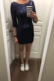 I normally wear an XS in any other Lulus dress but after reading other reviews about it running small I sized up and got the Small and am happy I did. It fits perfectly. It's a little bit shorter than I would care for but it still works and I really do love the dress. It's very comfy and the sequins don't rub around the neckline or sleeves. Plus it's a beautiful color. - Charlene H.