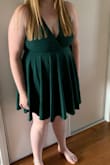 I love this dress just not the right colour for me so decided to get the black one but the one in this photo is the green. The sizes are accurate and the material is not cheap stuff. Would definitely recommend! - Louise H.