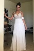 I love this dress! The beading on it was prettier than I could've imagined. It had everything I wanted too.. low back, light feel, whimsical look. I'm normally a size 4, which is what I ordered and it fit like a glove. For my height too it landed perfectly on on the ground, barely touching but would look great when I wore shoes. I seriously couldn't say better things about this dress. - Kayla P.