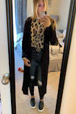 This cardigan is adorable! It's a great staple to have in the closet and can go with just about anything. I'm 5'5" and it hit me mid to lower calf.. which I loved!! It's on the thinner side which I'm actually happy with because I tend to wear a sweater or long sleeve shirt under it so I don't get too hot. Highly recommend! - Amber J.