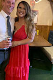 This dress was AMAZING! I wore it to a friends wedding and received so many compliments. It covered my chest well but because my chest is larger it was a bit showy. I didn't mind. It was a bit long but with a pair of heels it worked just fine! I am never a dress repeater but I'll wear this one again and again! - Calissa C.