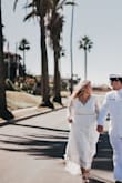 I saw this dress and instantly fell in love. My husband also loved it, and I received and still am receiving ton of compliments on it. It was perfect for our intimate beach wedding. I was comfortable and felt beautiful. I had a tailor add on a beaded belt I found, then she tightened the sleeves, hemmed the dress and the sleeves, and also took the dress in at the waist when I lost some weight. I definitely suggest finding a great tailor if the sleeves are too long or baggy like they were on me. The dress fit perfectly, and is worth every penny. I'm so glad I bought this dress. - Leslie P.
