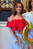 I LOVE this top. I wore it to a bachlorette party with a pair of white jeans and it was cute. Lots of compliments on it!  Very cropped. - Megan K.