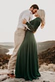 I wore this in my engagement pics and it had a lot of movement and was stunning. I was worried about it being too deep V since I'm busty, but was pleased with the coverage! Definitely recommend. - Hailey B.