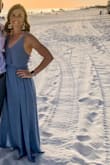 I wore this to a beach wedding and received so many compliments! The back is simply stunning. It's on the longer side, so I wore tall wedges with it. Runs true to size. - Casi L.