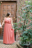 I got this dress for my engagement pictures and for a wedding this October. This dress was awesome because I was able to wear an adhesive bra without worrying that it would show in the front. It photographed beautifully and I would totally recommend it! - Sarah A.