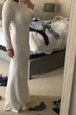 I wasn't sure what to expect with this purchase, especially for the price point. However, upon receiving it I can say that I am very impressed!
It is lined and not see through and it's a great length to wear with heels.
The back of the dress is also very pretty! The bottom is bustled on the bottom.
This dress would be prefect for a fall/winter wedding.
The sleeves are a little bit long but can easily be hemmed. - Danielle D.