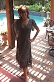 I'm a size 4 but with a lower waistline because of my height! Usually, a dress feels a little high waisted on me, but this dress hits my body Just right.
The fit is comfortable around my hips, waist and across the top. I usually like my clothes a little snug, in other words, the fit is not tight but against the body. It has a drape feeling and moves with you!
The length is perfect, not too low on the leg and the ruffles make you feel flirty! I love the tie across the bodice because you can make it as daring as you like or pull it together for a more serious event such as church.
The navy is dark, so at first, you might think it is black. The flowers emphasize the sophistication, but that I'm ready for a party. - Jennifer F.