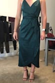 I go between a medium and a small, but chose to get a medium in this since I knew it was a zipper. I should have gone with the small I had plenty of room. The slit on the model looks above the knee and really flattering. I am disappointed with this because even if I move the dress over to try to make the slit that high it doesn't go there. Dress just looks a little too frumpy for me. - Gina G.