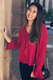 The ruffles are so fun! I wear this to work or whenever I need to wear business casual. Super fun top. The red color really pop! Helps you stand out if you like that. Material is great and it's not see through. - Stephane L.