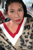 Warm neck leopard sweater I purchased my true size and was able to wear with leather leggings as sweater was large enough to cover my bottom. Would buy again! - Marisa W.