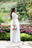 I wanted something elegant, simple and romantic for our 10 year wedding anniversary celebration. My husband and I decided to do a a very small vow renewal with just us and our two boys. The dress needed about an eight in hem and I shortened the sleeves. I used the extra lace to expand the modesty panel in the back to hid a bit more. Being a mom of two, I didn't feel comfortable showing so much of my bare back. But everything else fit perfectly and it was a beautiful dress. I felt lovely and gorgeous in it. Thanks Lulus for a wonderful quality dress, looking at it no one could tell it was less than $90!! :) - Tina N.