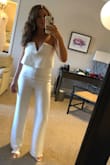 I have this jumpsuit in 2 colors now. I wore the white one to my Wedding Rehearsal and got so many compliments. It is still the most flattering outfit I own. I ordered an XS this time because it was the only one left and was willing to risk it! It fit just as good as the small did, just a little more snug up top (which actually ended up being better for it staying up!) love love love. - Sarah B.