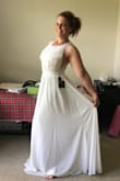 Perfect wedding Dress. Order your true size. Couldn't be happier. Returned the but kept the pink. I wish I'd kept the smaller one but still love it. - Nicole G.