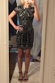 Ill start off saying I probably could have sized down in this dress but then I don't think it would look as classy. This dress is very pretty and can be worn to multiple kinds of events from a night out to a wedding to a holiday party. Its a little long for a short dress but I personally like it that way. Careful of the sequins they seem as though they would pull easily. Nothing bothered me about the fit or the material. Accentuated the little curves I have. I recommend purchasing! - Casey F.