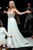 This dress is an absolute showstopper! I purchased it as my wedding reception dress as I wanted something light, flowing and sparkly to dance in. It is such a beautiful dress and I loved it from the moment I put it on. It is quite long if you are shorter and I did have some alterations done on the bodice. The see-through around the mid-section showed a little more skin than I wanted but my alterationist  was easily able to sew in a nude fabric. This dress looks like a high quality designer gown and makes you feel like a total princess. - Veronica F.