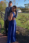 I absolutely LOVED this dress- worn for a mid-october wedding. I initially ordered it in a medium but needed to exchange it for a large. My measurements run me right in-between a medium and large but since the material looked like it would stretch I went with the medium. The medium ended up being a tad too small, there is no give in the fabric around the rib cage so I ended up having to exchange it for a large. I did need to get it hemmed, have the waist taken in and the straps shortened but it was so worth it. I got SO MANY compliments, and was so comfortable. The leg slit is the perfect amount of sexy and the deep V front and back showed off just enough skin without worrying showing side boob. There is also a nice weight to the dress that had me comfortable outside at an evening ceremony, during mid-october, in New Hampshire. - HIllary L.