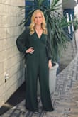 I absolutely loved this jumpsuit! I normally have a hard time with jumpsuits fitting me weird in the inseam & crotch area, but this one fit perfectly! I wore it to a gala that I had to work so it was the perfect formal yet functional outfit! The color was a little darker than I had imagined from the picture on the website but I still loved it. The pant legs are pretty long but fit me perfectly with a medium sized heel! - Kacy C.