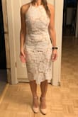 I bought this for my courthouse wedding ceremony after way too many hours of shopping online. I love the length and the pattern of the lace and how flattering the cut of this dress is! True to size, maybe just a little tighter than I expected. - Emma A.