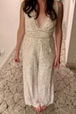 I bought this to wear to my wedding reception's after-party (obviously wasn't crazy about the idea of wearing my wedding dress to a bar). I got compliments all night! The top was a little loose but that's normal for me, so I took it to a tailor to get it taken in & it was totally worth it. It felt like I was wearing pajamas all night! The length was perfect with the heels I wore. I will definitely be finding an excuse to wear this again. - Ava P.