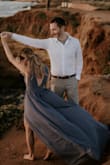 It felt so magical wearing this dress for our engagement photos! It easily picked up with the wind. The deep v-neck wasn't over exposing. Overall, amazing dress and great quality definitely recommend buying! - Laura S.