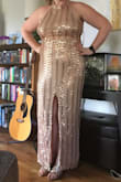 I was skeptical at first, the scalloping wasn't my favorite on the model, but in person it's absolutely gorgeous. I tried it in an XL and a Large and the XL was WAY too big (XL pictured, and I had about a handful of dress pinched in the back to make it fit. I need a strapless bra, but you could wear this without one at all. The large fits my body perfectly and I cannot wait to wear this to my friend's wedding. Super flattering. Great fabric, LOVE it! - Ariel G.