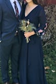 This dress is beautiful and classy. I received many compliments on it for a fall wedding. The only problem was the way it fits on the top. It is very low cut and revealing for someone who is not very busty. I ended up getting it sewed so it wasn't too revealing, but since it's a wrap dress I had to then maneuver the dress over my head without ripping the stitches to get it on. Overall, I loved the dress! - Jillian M.