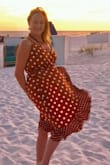I bought this dress for a beach wedding in early October. I felt like 10 million bucks in it!  The fit was perfect: very comfortable and very sexy. I loved it so much I bought two other colors!! The brown will always be my favorite though! I highly recommend this dress - especially for outdoor events in the summertime. - Robin A.