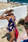 This romper does run a little small so I suggest sizing up. Still glad I got it though...I wore it on a little day excursion to one of the islands. It was lightweight festive and comfortable! - Alex K.