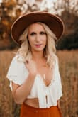 I *LOVE* this top! It's snug to get over the girls but it stays put and I wasn't worried about it exposing anything. It was the perfect boho look for photos! Love love love! - Julie I.