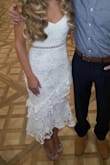 This dress was everything I wanted in an engagement party dress but the sleeves just weren't doing it for me. I took it to my tailor who removed the sleeves and added straps. This dress was so beautiful between the lace and see through panel. I was so pleased with it! I searched many places but did not find a dress as beautiful and well made. - Kristy S.