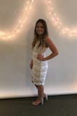 I ordered this dress to wear for my bridal shower. Overall I was very happy with the dress. It looked great on, was very flattering, and is great quality. Only downside I noticed was that it was a little baggy in areas (I normally wear a medium in more form fitting pieces) and the material was not as stretchy as I expected. If you are looking for a tighter fit, I would definitely recommend sizing down. However, I still loved the dress and felt great in it! - Lauren R.