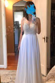 This was a pretty dress! It wasn't the most flattering cut for me, but here're the pros and cons: Pros: intricate beading, cups do not show up (nude cups, but I understand they could show up on other skin tones), light, overall very pretty. Cons: the waist area was loose, straps a little long for my height and alterations would've cost a bit. Would I recommend this dress to others: absolutely. Give it a chance if you're looking for a pretty, value-for-money wedding dress! - Hannah K.
