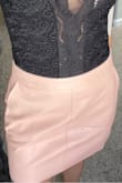 I love this skirt!! I was surprised by how soft it feels and it doesn't look too "leathery". I do wish it was a little tighter around the backside, but it fits great! Would definitely buy again! (It looks lighter in the photo - I was in direct sunlight) - Kylie D.