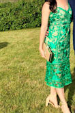 I loved wearing this dress and received many compliments on the color. It didn't lay flat between the green lace and under layer which bothered me a little. Also, one of the straps snapped by the end of the night. I enjoyed wearing this one time but probably won't wear it again because of the nuances. - Lindsay C.
