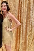 I wore this dress for a 20's Charity Gala. LOVED IT. I got tons of compliments. Under the strings are scalloped sequins, so when you're twirling, you light up the dance floor. I will definitely wear this dress again. The dress fit true to size! - Maddi O.