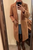 DEFINITELY SIZE DOWN - I ordered all three sizes (S, M, L) to figure out what would look best because this coat was exactly what I was looking for for the upcoming winter - it's perfect and can still button, but I am normally a M/L than a S so order a smaller size. - Lizzie S.