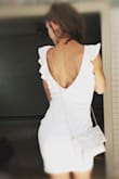 I wore this dress to my bridal shower and loved it! I loved the high neck in the front and the V back with the ruffles! It was so flattering too! - Sarah K.