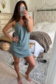 I wore this often this summer to the beach and also a few lunches out. I love the drape and the way it hangs. The fabric is light but not sheer. I did have to tie the back straps together to raise the v in the front as to cover up a little more. I love the color. - Summer H.