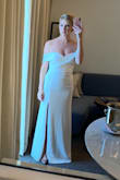 I really loved this dress and it was perfect for my elopement. I bought it in a S and XS to have options: the Small fit well - it was snug in the hips and overall the top laid well. It probably would have fit on top a little better if I had a larger chest but my hips couldn't squeeze in the XS and I had to adjust the top fairly often during photos but it was flattering and with a strapless bra made the girls look good. Also, by the end, the stitching was coming undone at the top of the front slit. - Moriah P.