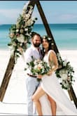 I wore this for my boho Elopement beach wedding and it was absolutely perfect. I received tons of compliments on it, too. I was nervous about getting a small or a medium size since I'm on the border of the size chart but the small was perfect. It was a little tight around the rib cage (Especially when the beer and Champagne started flowing) but wasn't uncomfortable. As others have stated, it's a little long barefoot or with flats but I didn't get it hemmed since it's a flowly dress and worked well with the boho theme. I will say this dress wasn't my first choice b/c it seemed a little blah but it's much more spectacular and romantic looking in person. - Robin H.