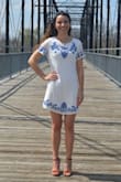 I wore this dress for graduation pictures! Super cute for spring/summer. It is a little see through so I wore a slip since it was for graduation pictures. - Amber